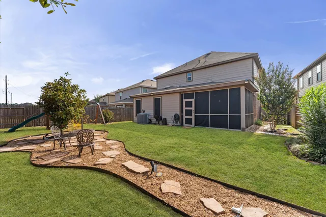 an aerial view of houses with outdoor space