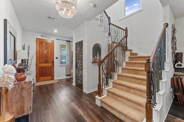 a view of entryway with wooden floor