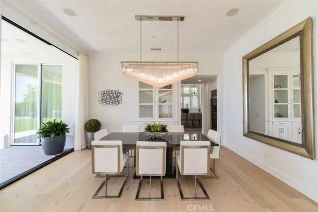 a dining room with furniture a kitchen and kitchen view