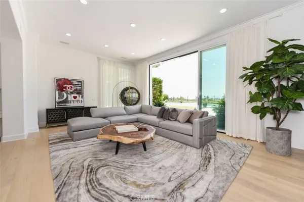 a bathroom with a sink a toilet a mirror and shower