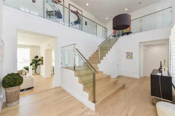 a view of a living room with furniture and a large window