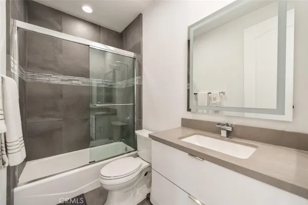 a view of a swimming pool with an outdoor space and seating area