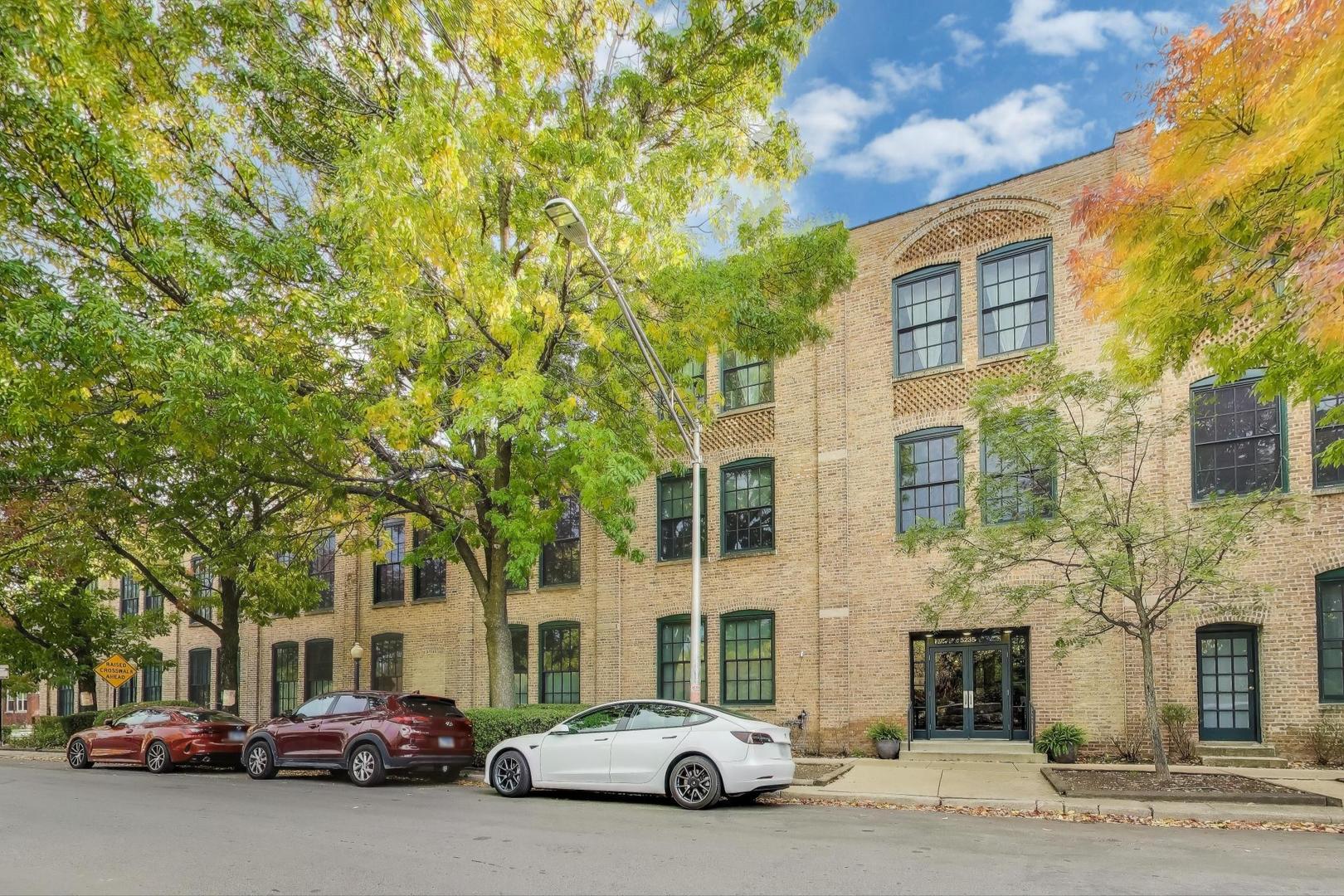 5235 North Ravenswood Avenue, Unit 3 Chicago, IL 60640 - Photo 1 of 27 a car parked in front of a building
