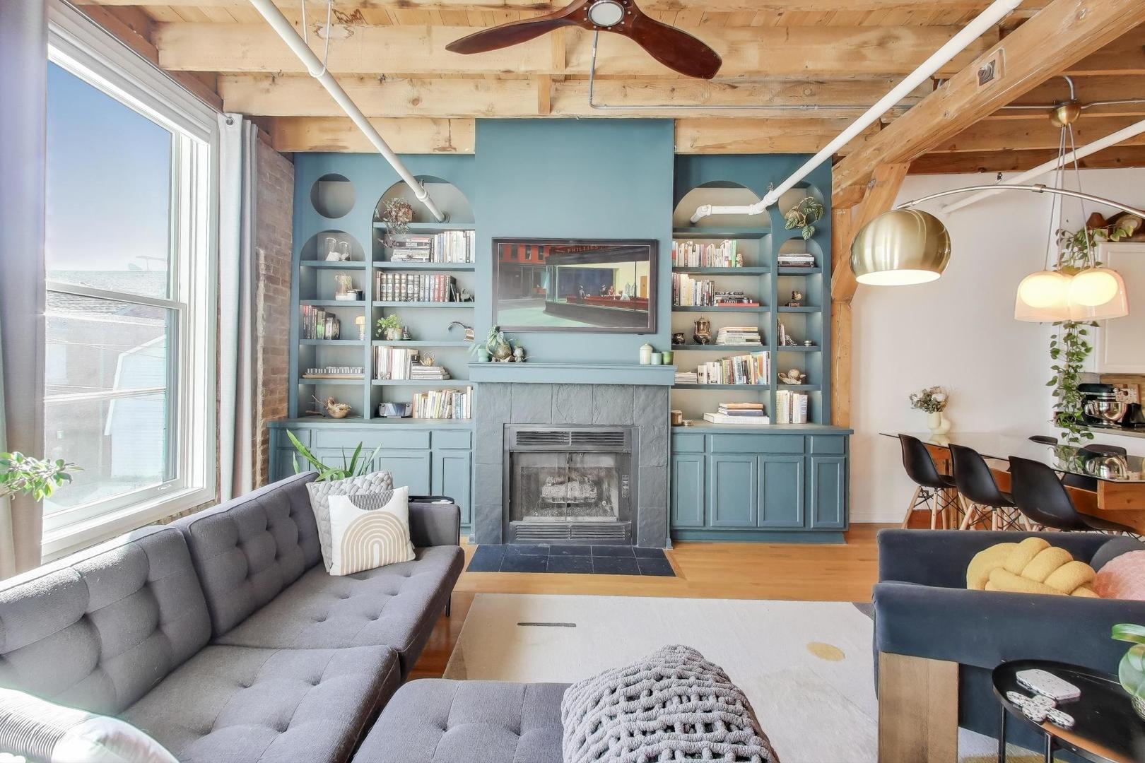 5235 North Ravenswood Avenue, Unit 3 Chicago, IL 60640 - Photo 11 of 27 a living room with furniture and a fireplace