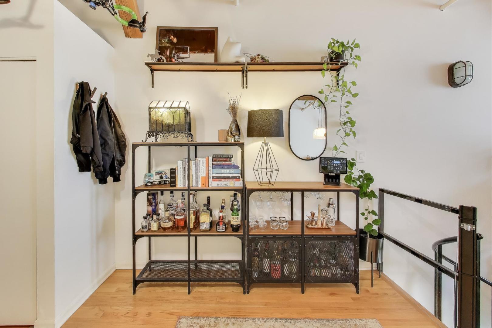 5235 North Ravenswood Avenue, Unit 3 Chicago, IL 60640 - Photo 13 of 27 a view of entryway and hall with wooden floor