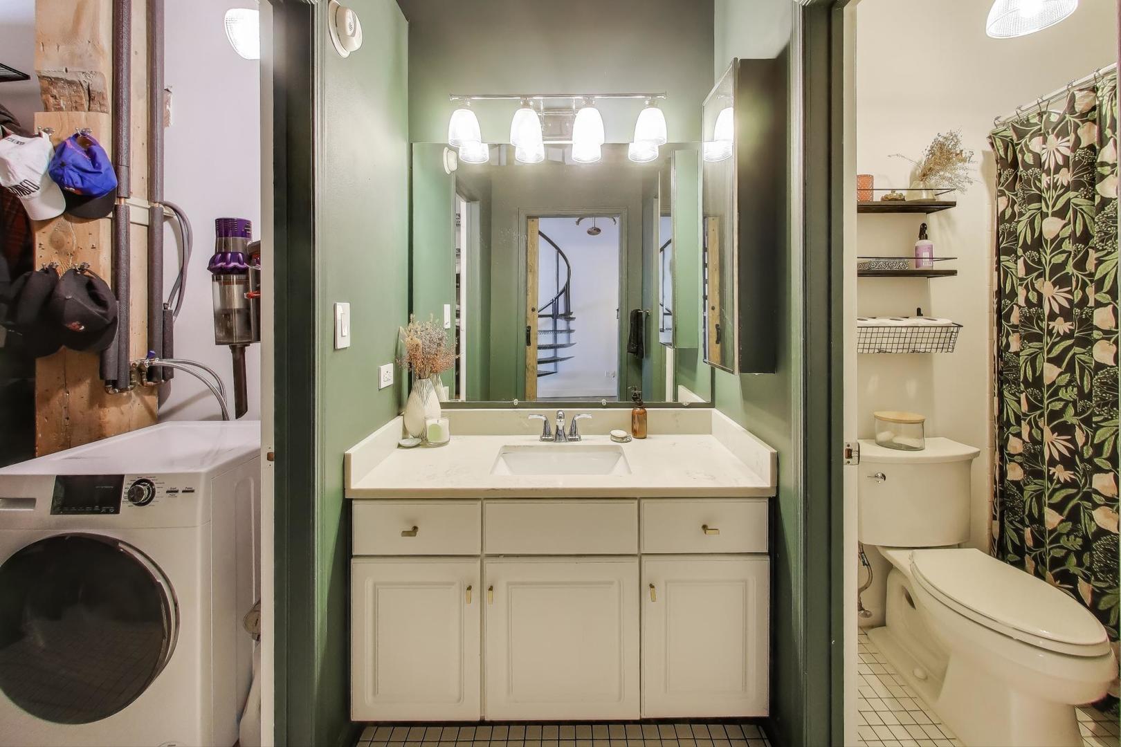 5235 North Ravenswood Avenue, Unit 3 Chicago, IL 60640 - Photo 20 of 27 a bathroom with a sink and a mirror