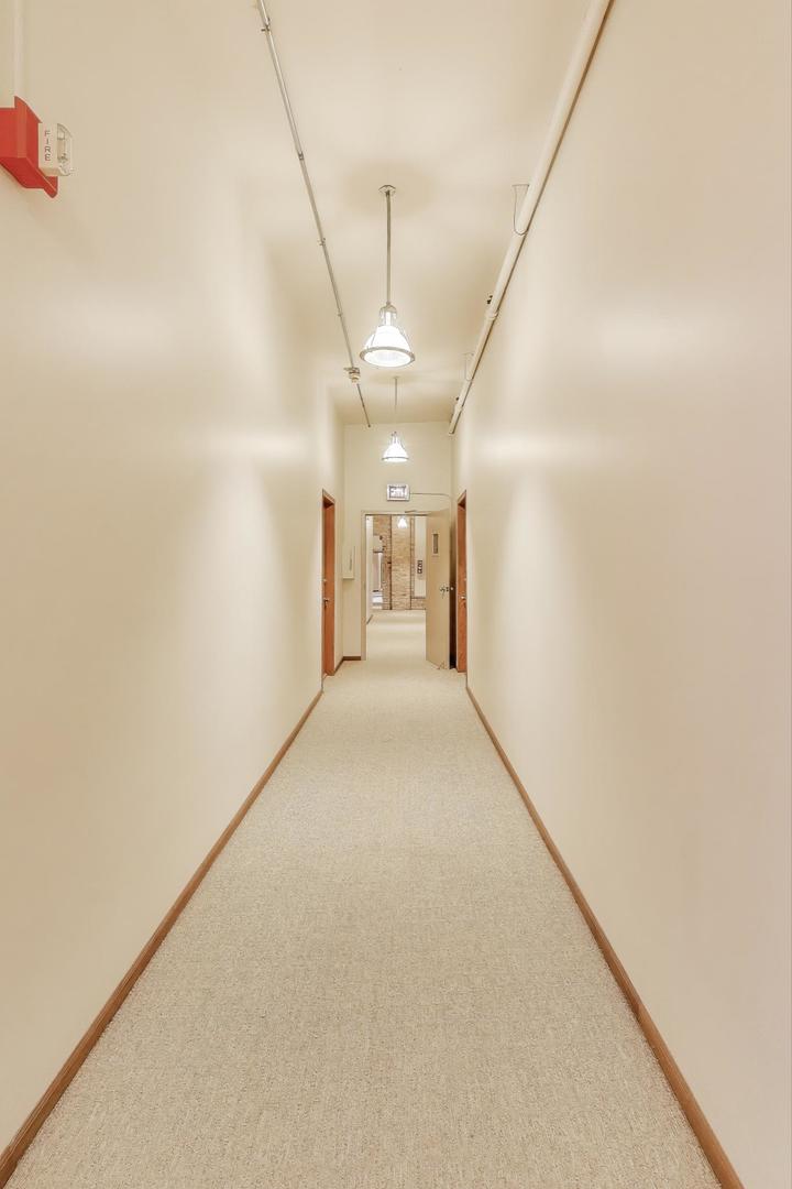 5235 North Ravenswood Avenue, Unit 3 Chicago, IL 60640 - Photo 8 of 27 a view of a hallway with a white walls