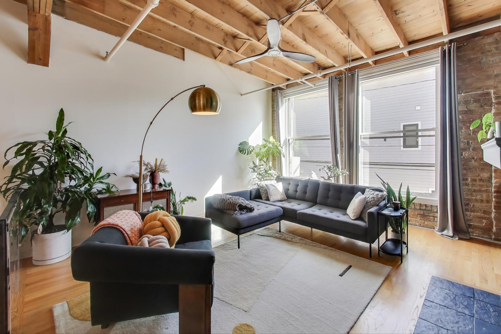 5235 North Ravenswood Avenue, Unit 3 Chicago, IL 60640 - Photo 9 of 27 a living room with furniture and a large window