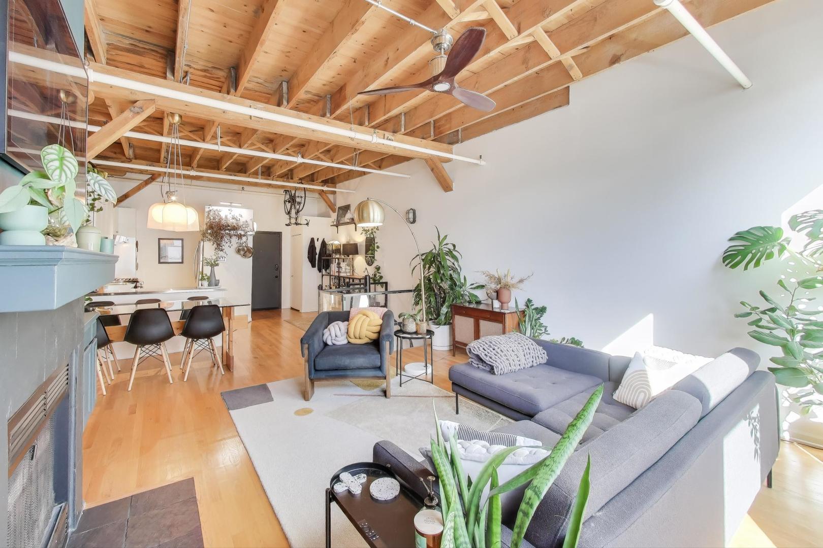 5235 North Ravenswood Avenue, Unit 3 Chicago, IL 60640 - Photo 10 of 27 a living room with furniture and wooden floor