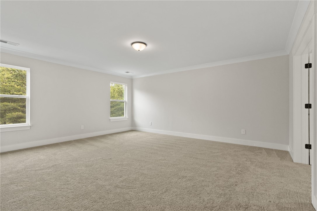 313 Old Shirley Road Central, SC 29630 - Photo 20 of 30 This spacious room features ample natural light and plush carpeting, ready for your personal touch.
