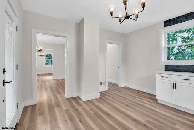a view of a kitchen from the hallway