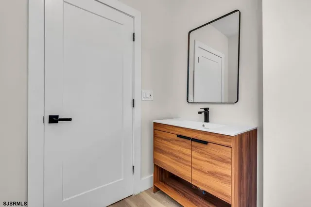 a bathroom with a sink and a mirror