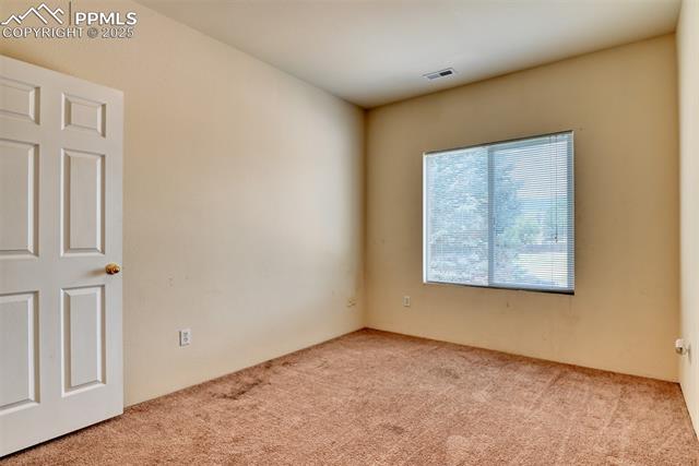 2049 Legacy Ridge View, Unit 111 Colorado Springs, CO 80910 - Photo 24 of 32 View of carpeted spare room