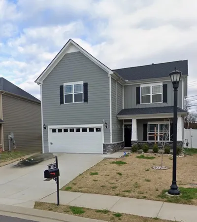 a front view of a house with street