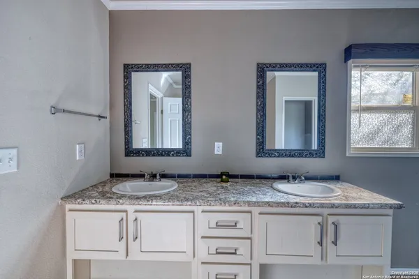 a bathroom with a shower and a sink
