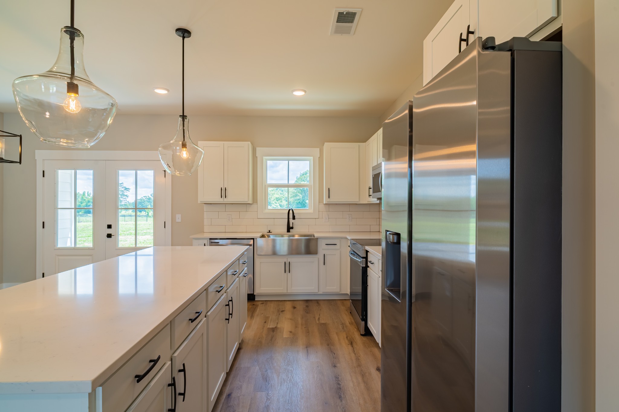 189 Strawberry Ridge Manchester, TN 37355 - Photo 20 of 56 a kitchen with stainless steel appliances granite countertop a refrigerator a sink and a chandelier