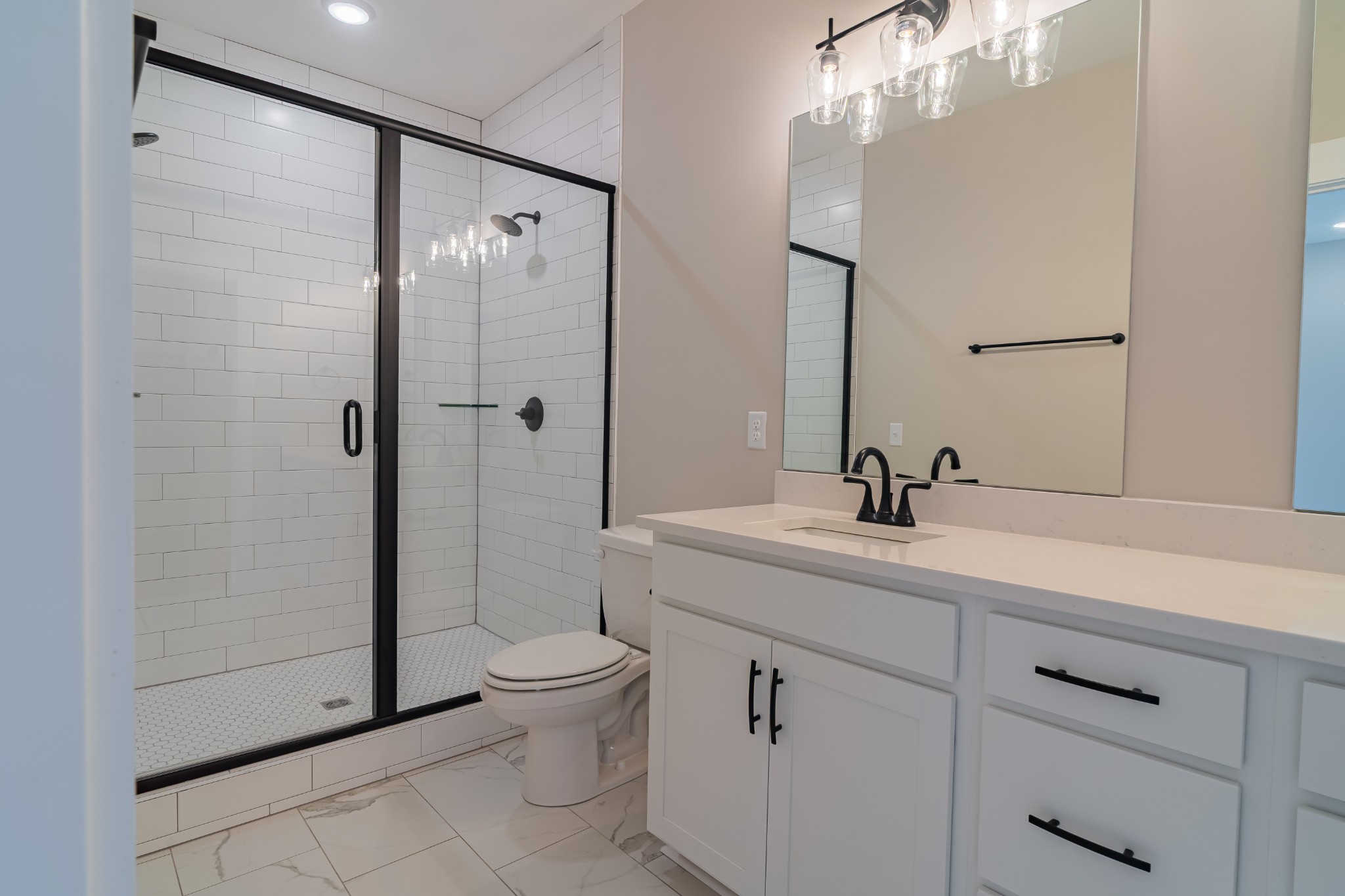 189 Strawberry Ridge Manchester, TN 37355 - Photo 25 of 56 a bathroom with a shower sink vanity mirror and toilet