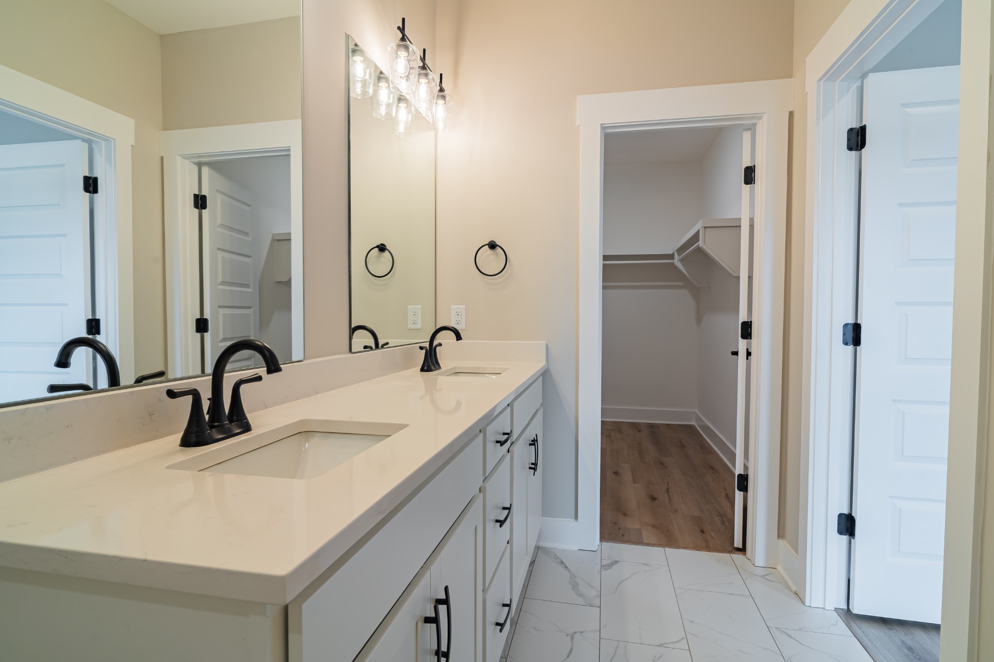 189 Strawberry Ridge Manchester, TN 37355 - Photo 27 of 56 a bathroom with a double vanity sink and a mirror