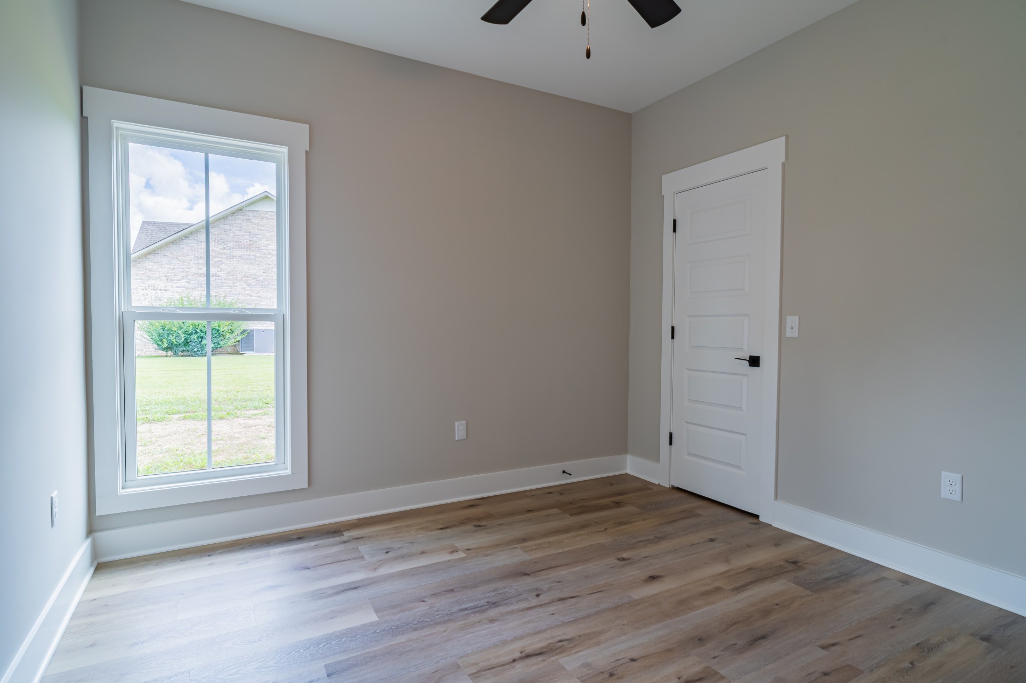 189 Strawberry Ridge Manchester, TN 37355 - Photo 38 of 56 an empty room with wooden floor and window