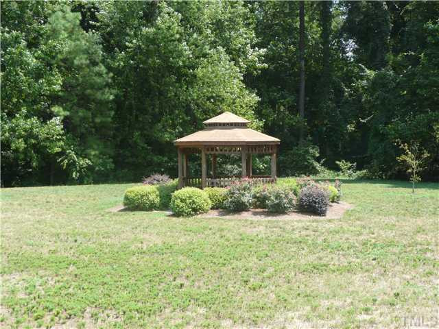 5635 Bridgetowne Way Raleigh, NC 27609 - Photo 18 of 18 a front view of house with yard and trees