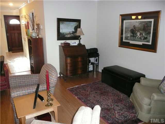 5635 Bridgetowne Way Raleigh, NC 27609 - Photo 7 of 18 a living room with furniture and a flat screen tv