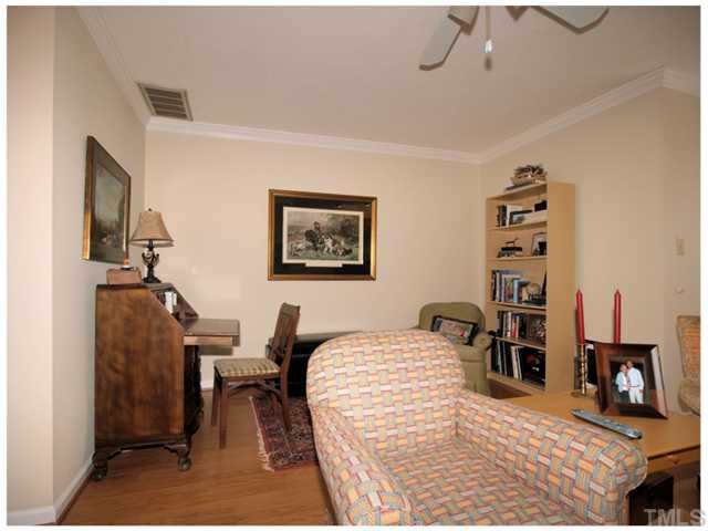 5635 Bridgetowne Way Raleigh, NC 27609 - Photo 8 of 18 a bedroom with a bed and furniture