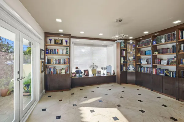 a living room with hard wood flooring