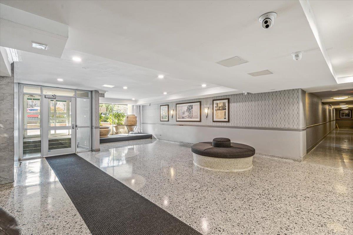 18-65 211th Street, Unit 4C Queens, NY 11360 - Photo 15 of 16 a living room with furniture and a wooden floor