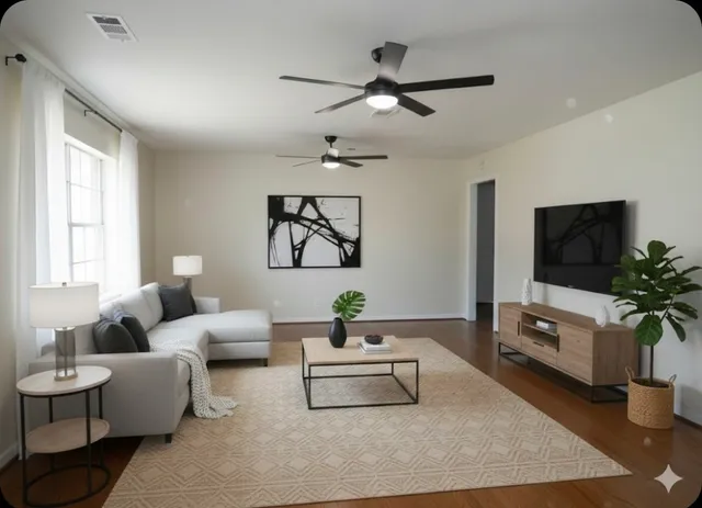 a living room with furniture and a flat screen tv