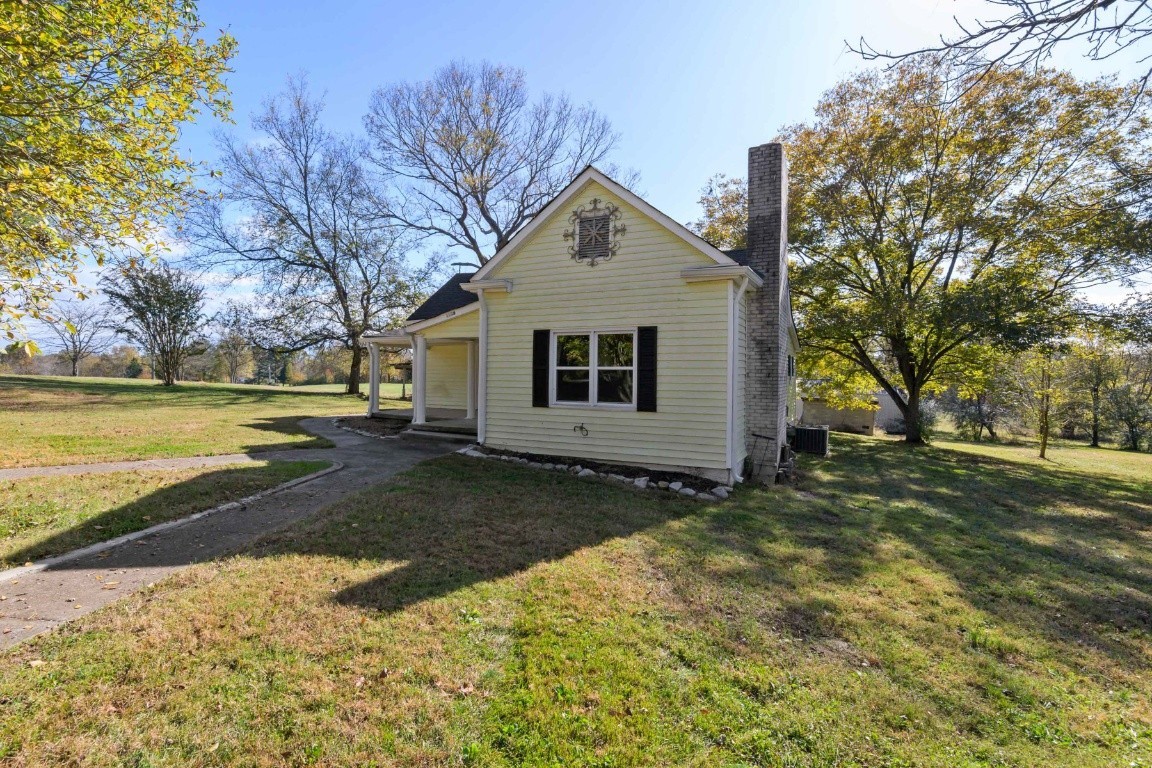 2480 Mann Road Lebanon, TN 37087 - Photo 2 of 35 a view of a house with a yard and covered with snow in the background