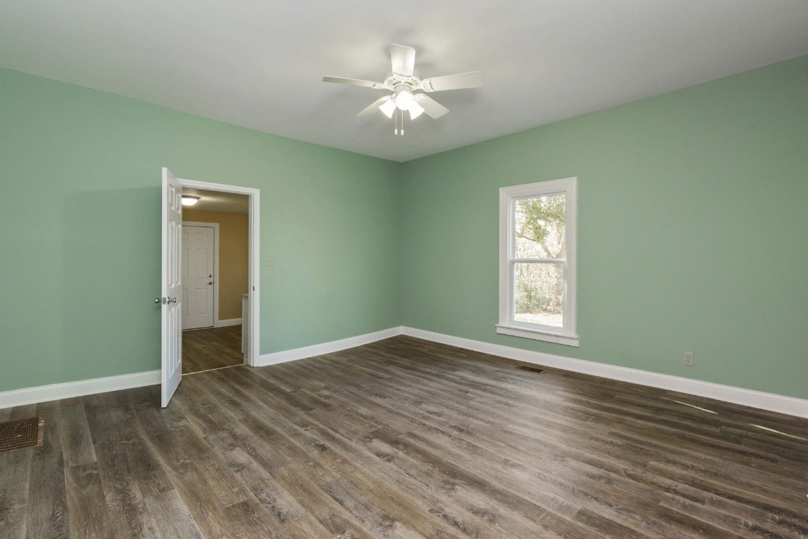 2480 Mann Road Lebanon, TN 37087 - Photo 19 of 35 a view of an empty room with wooden floor and a window