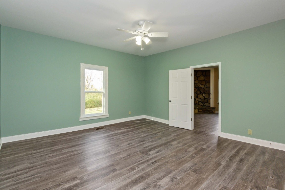 2480 Mann Road Lebanon, TN 37087 - Photo 20 of 35 a view of an empty room with wooden floor and a window