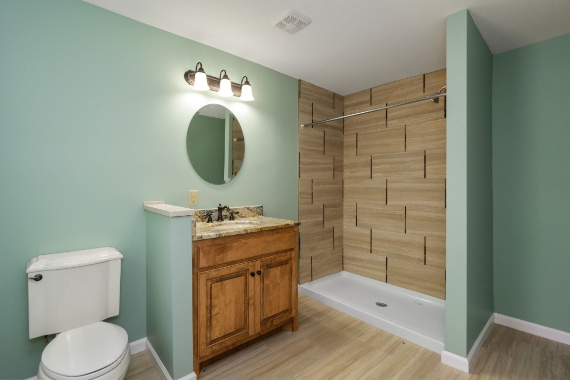 2480 Mann Road Lebanon, TN 37087 - Photo 29 of 35 a bathroom with a toilet a sink and shower