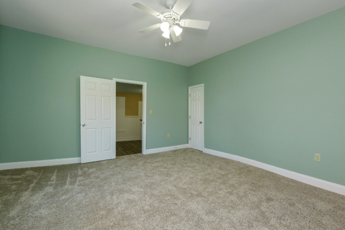 2480 Mann Road Lebanon, TN 37087 - Photo 33 of 35 an empty room with closet and a chandelier fan