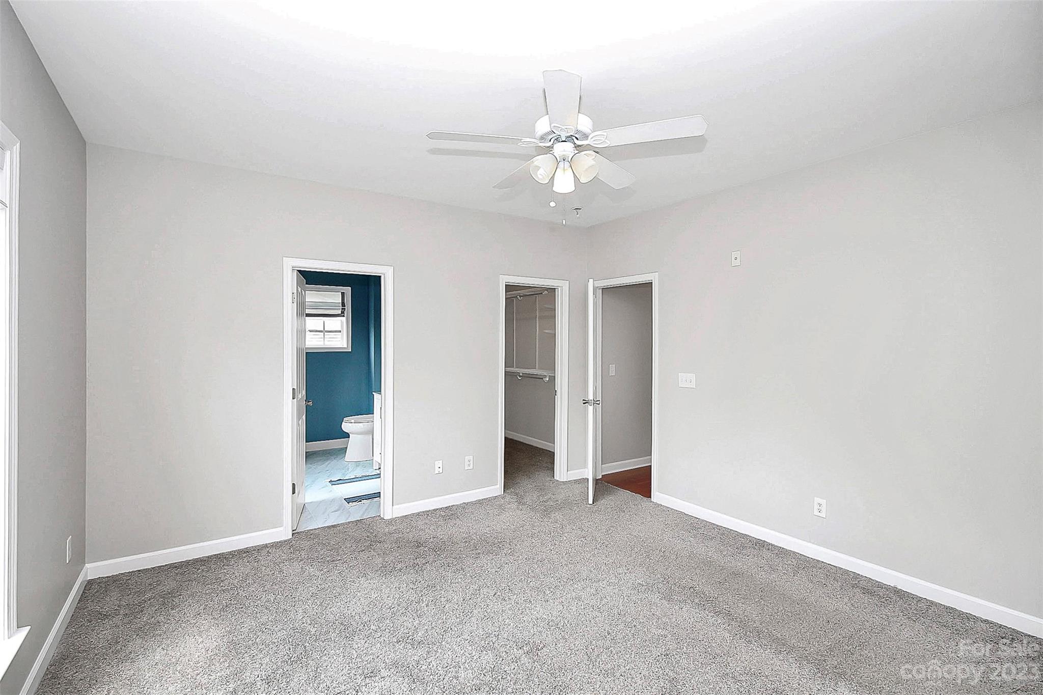 4162 Walker Road Charlotte, NC 28211 - Photo 12 of 25 an empty room with closet and fan