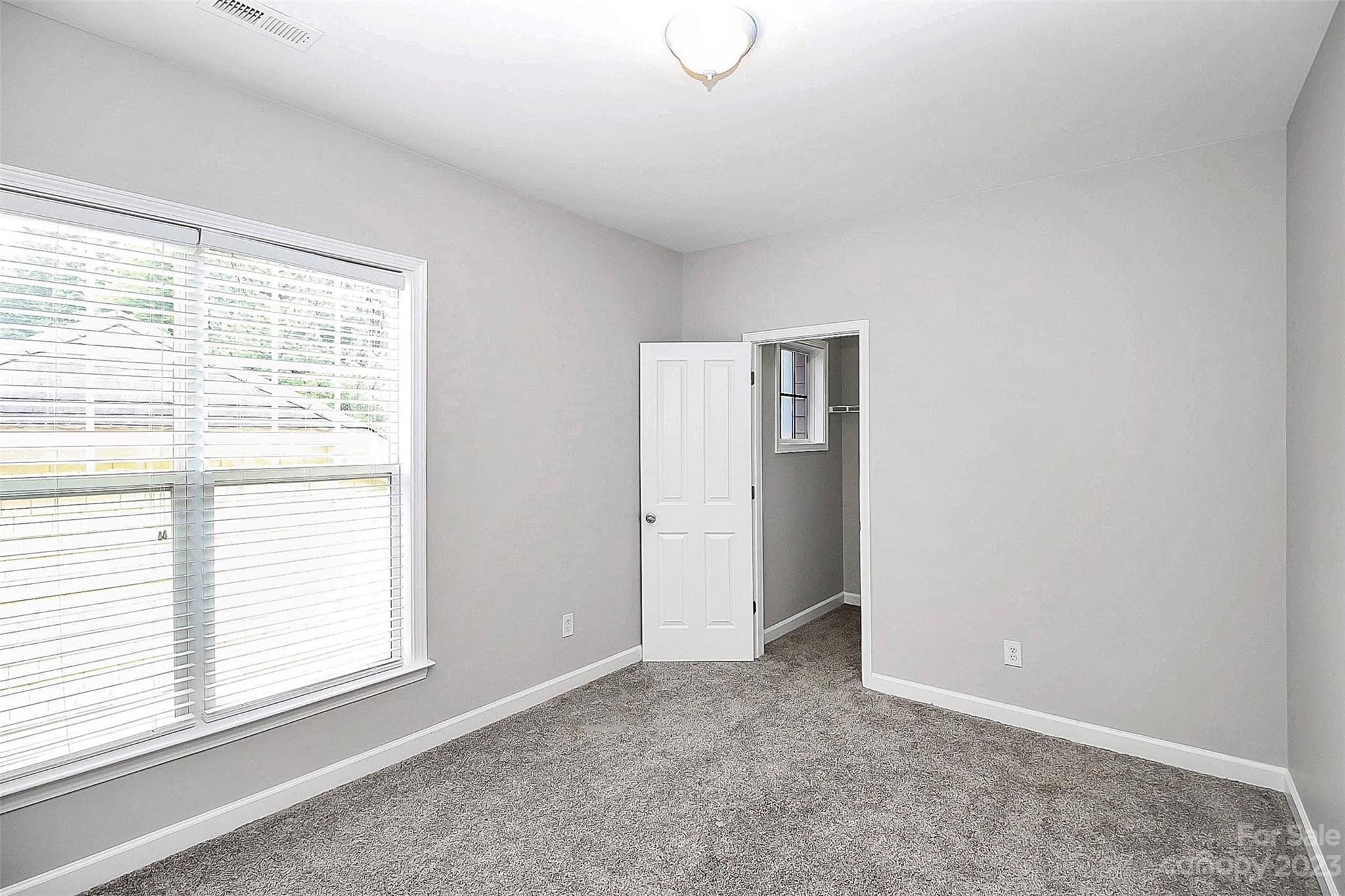 4162 Walker Road Charlotte, NC 28211 - Photo 17 of 25 a view of an empty room with a window