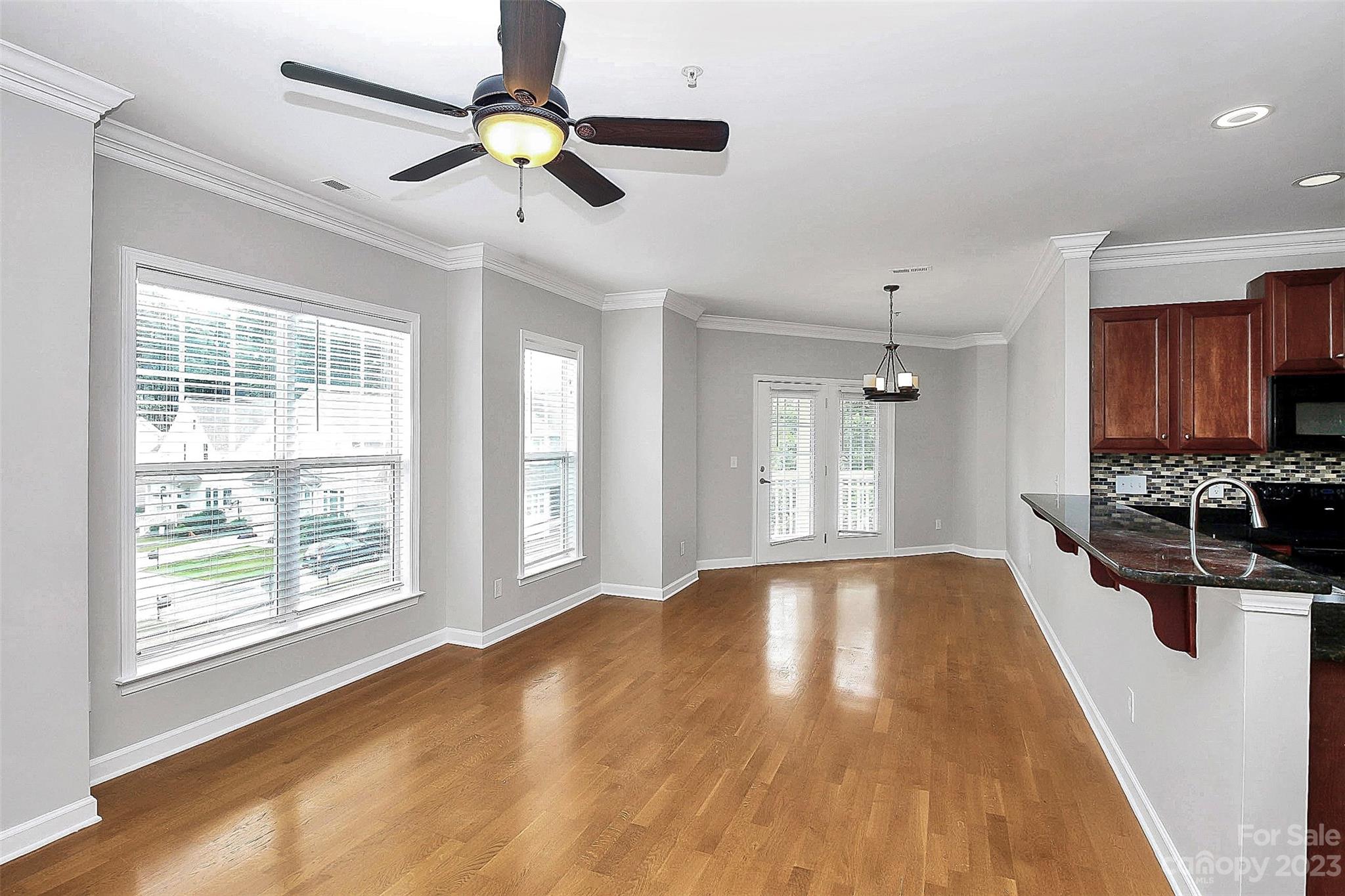4162 Walker Road Charlotte, NC 28211 - Photo 3 of 25 a view of an empty room with window and wooden floor