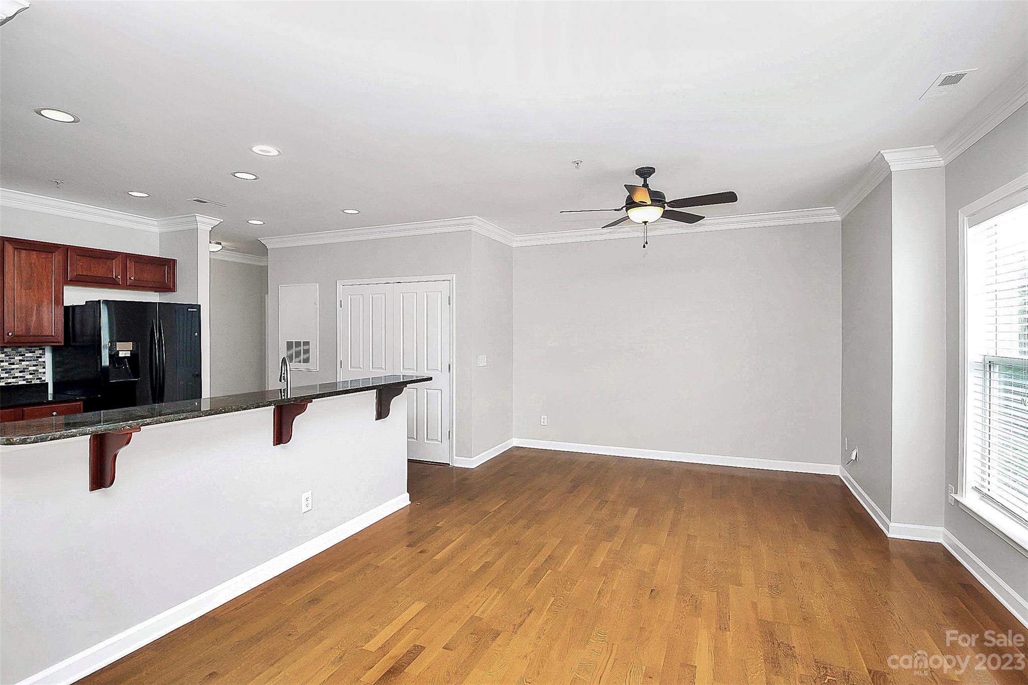 4162 Walker Road Charlotte, NC 28211 - Photo 5 of 25 wooden floor in an empty room with a window
