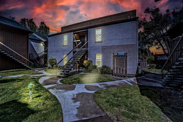 a front view of a house with garden