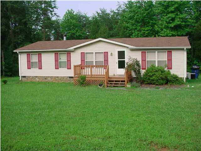 318 Miles Jackson Road Palmyra, VA 22963 - Photo 1 of 2 a front view of a house with a yard and green space