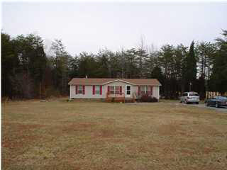 318 Miles Jackson Road Palmyra, VA 22963 - Photo 2 of 2 a view of a house with a big yard plants and large trees