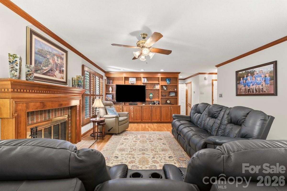 207 Lost Corner Road Morganton, NC 28655 - Photo 24 of 46 a living room with furniture a flat screen tv and a fireplace