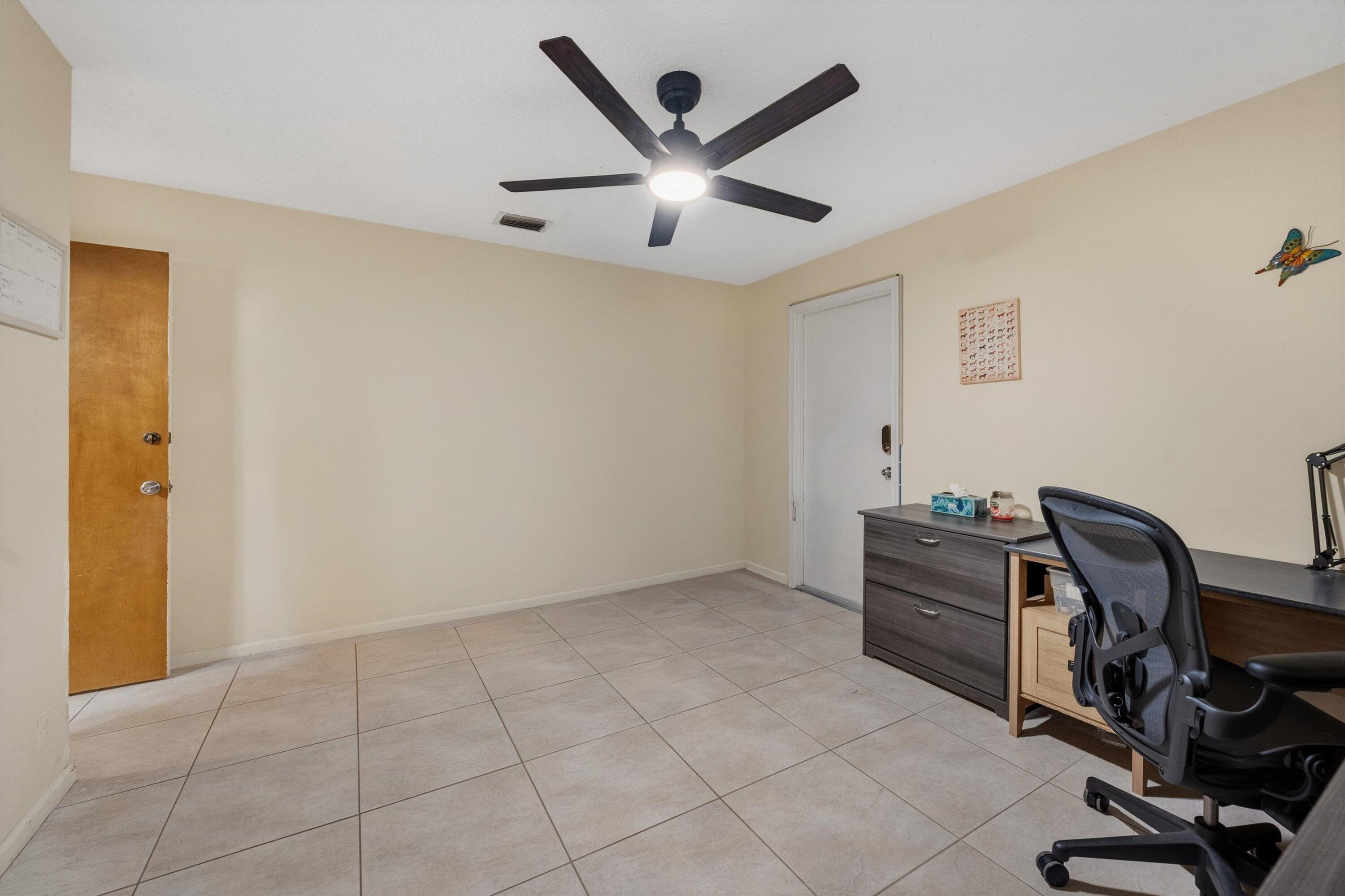 7169 154th Road North Palm Beach Gardens, FL 33418 - Photo 26 of 62 a workspace with a desk