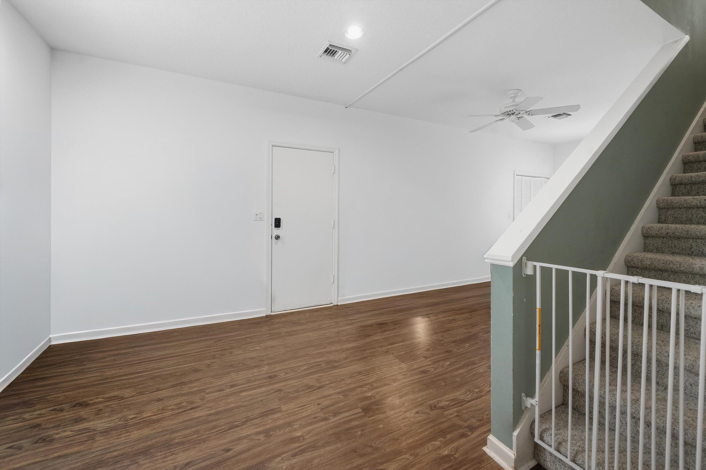 7169 154th Road North Palm Beach Gardens, FL 33418 - Photo 29 of 62 a view of an empty room with wooden floor