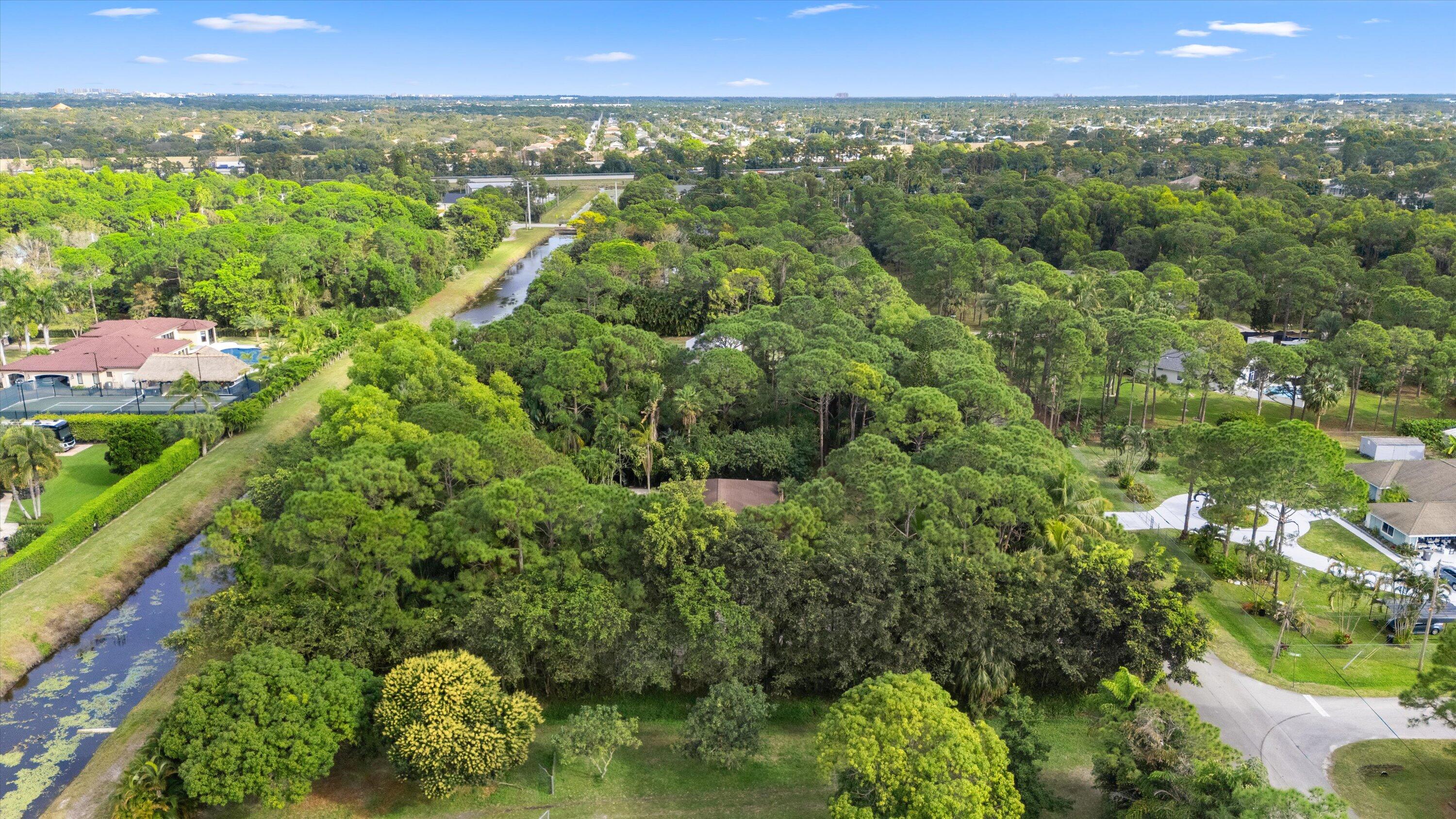 7169 154th Road North Palm Beach Gardens, FL 33418 - Photo 56 of 62 a view of a city with lush green forest