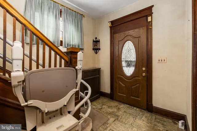 a picture of a room with a white wall and sign