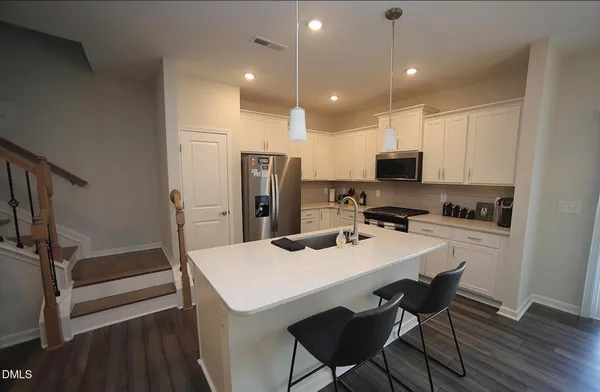 a view of swimming pool with outdoor seating and yard in back