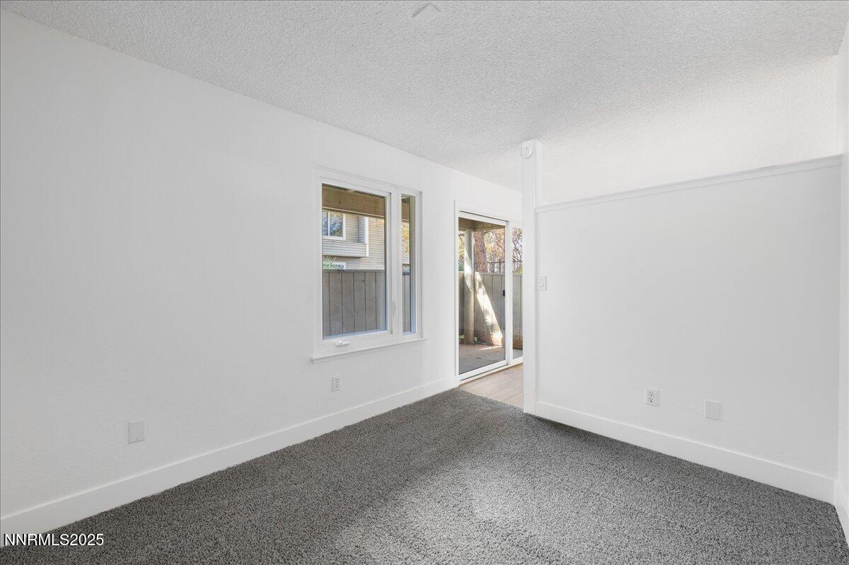 2136 Roundhouse Road Sparks, NV 89431 - Photo 20 of 26 an empty room with windows