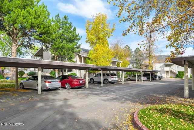 a view of a car parked in front of a house