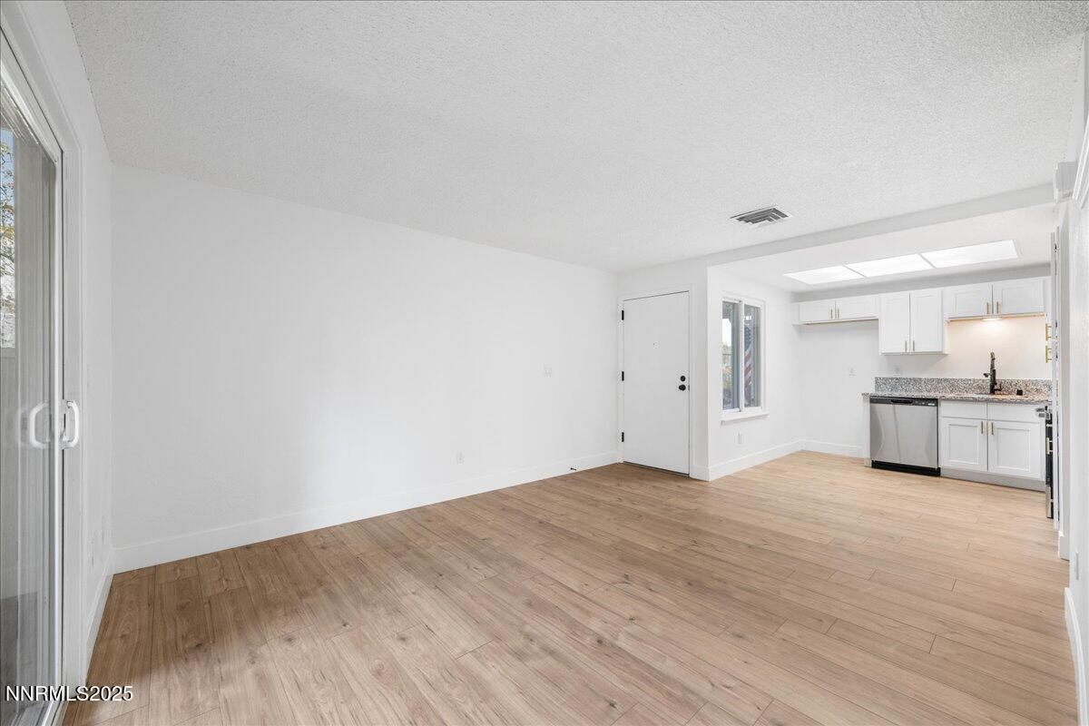 2136 Roundhouse Road Sparks, NV 89431 - Photo 5 of 26 a view of a kitchen with wooden floor